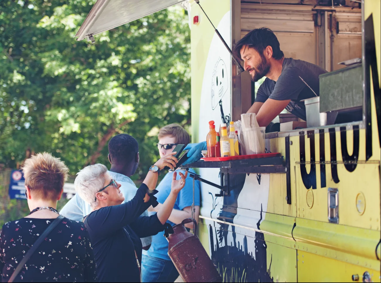 Customers ordering at a food truck window